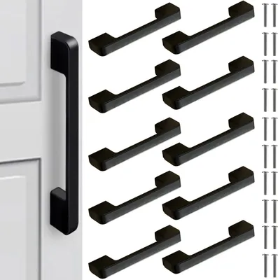 A collection of black cabinet handles and screws arranged on a white background.