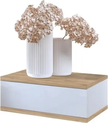 Two white vases with dried flowers on top of a floating nightstand.