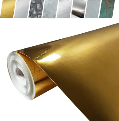 A roll of gold metallic adhesive film, with a selection of other finishes shown in the background.