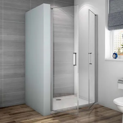 A modern bathroom with a glass shower enclosure.