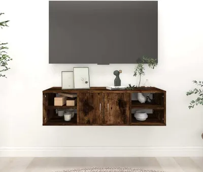 A wall-mounted media console with a television above it.