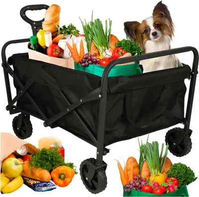 A black folding shopping trolley filled with groceries and a small dog sitting in it.