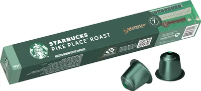 A box of Starbucks Pike Place Roast coffee capsules for Nespresso, with two capsules shown in front.