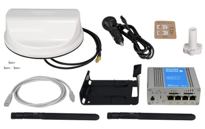 A collection of electronic devices and accessories laid out on a white background.