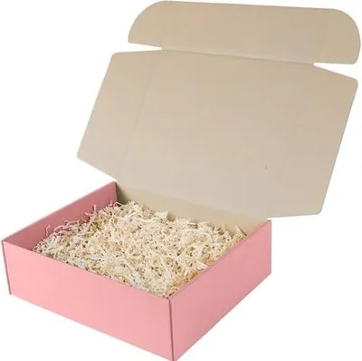 An open pink cardboard box filled with shredded paper.