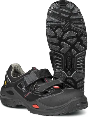 A pair of black safety sandals with red accents and a separate sole shown.