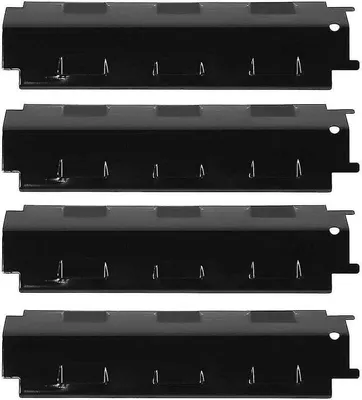 Four black metal grill heat plates are stacked on top of each other against a white background.
