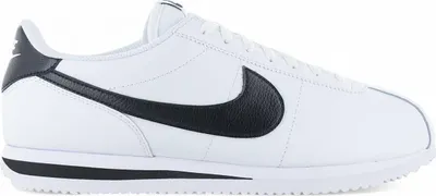 A side view of a white Nike Cortez sneaker with black accents.