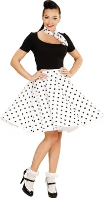 A woman is posing in a 50s-style outfit.