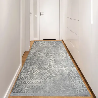 A hallway with a rug.