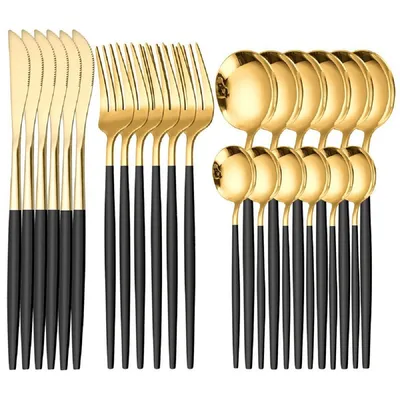 A set of gold and black cutlery arranged neatly on a white background.