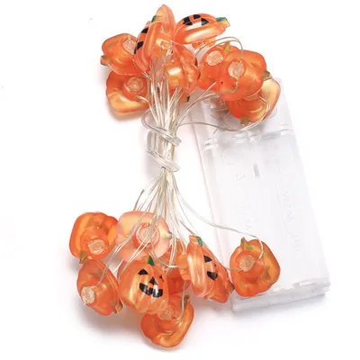 A string of Halloween-themed pumpkin-shaped LED lights with a battery pack.