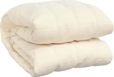 A folded cream-colored weighted blanket.