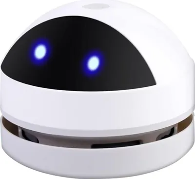 A white mini desktop vacuum cleaner with blue glowing eyes.