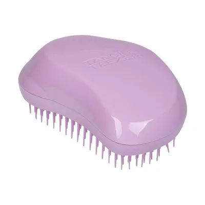 A purple Tangle Teezer hairbrush is shown against a white background.