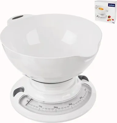 A white mechanical kitchen scale with a white bowl on top, shown against a white background. A small box with the brand logo and an image of the product is in the upper right corner.