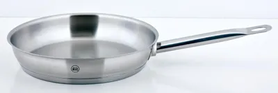 A stainless steel frying pan on a white background.