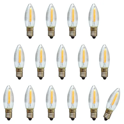 A collection of LED filament bulbs arranged in rows on a white background.