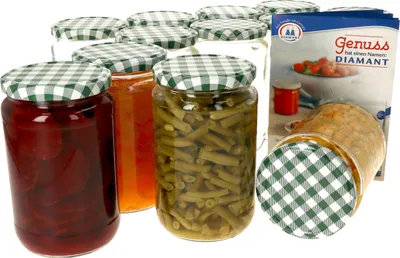 A collection of glass jars filled with preserved food items, such as beets, jam, and green beans, with checkered lids, and a product box in the background.