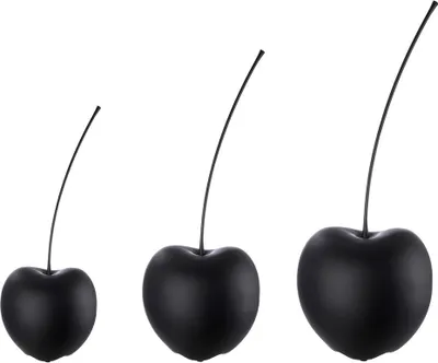 Three black ceramic cherries of increasing size are displayed against a white background.