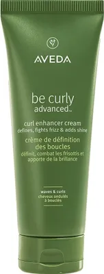 A green tube of Aveda Be Curly Advanced Curl Enhancer Cream.