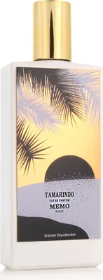 A white perfume bottle with a decorative label depicting a sunset over water with palm trees.
