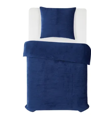A top-down view of a blue duvet and pillow set on a white surface.
