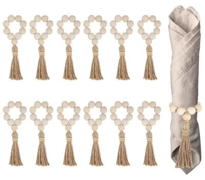 Immagine prodotto di Perline di legno con nappine - Portatovaglioli - Set da 12 pezzi - Stile boho country - Decorazioni per la tavola a tema Natale e matrimonio - Naturale