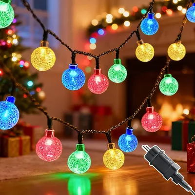 Immagine prodotto di Catena luminosa da 10 metri - Con spina - Grado di protezione IP44 (resistente all'acqua) - 8 modalità di illuminazione - Luce calda - Ideale per Natale - Adatta per interni ed esterni