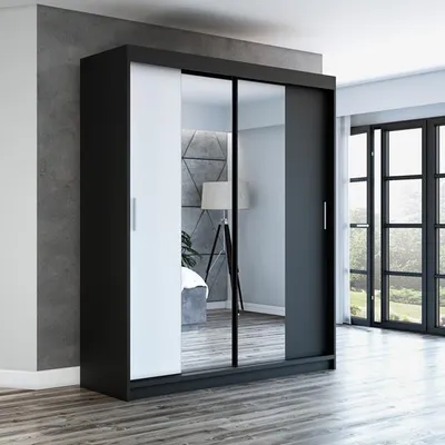 A modern wardrobe with sliding doors, one of which is mirrored, is shown in a room setting.