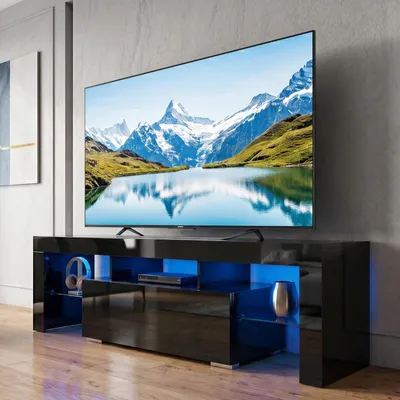 Zdjęcie produktu dla Szafka pod telewizor FCH z oświetleniem LED i 1 szufladą – szafka pod telewizor 130 x 35 x 45 cm, czarna