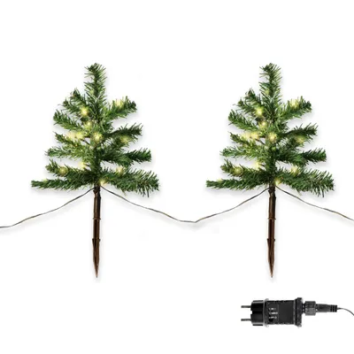 Two small, artificial Christmas trees with warm white LED lights, each on a stake, and a power adapter are shown against a white background.