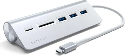 A silver Satechi USB-C hub with multiple ports and a white cable with a USB-C connector.