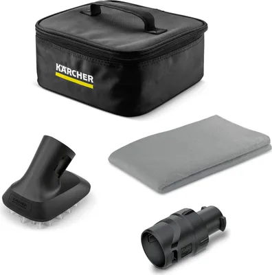 A collection of cleaning accessories for a Kärcher product, including a storage bag, a brush attachment, a microfiber cloth, and an adapter.