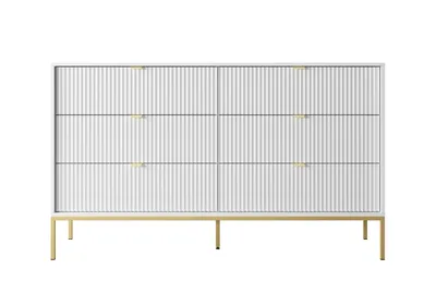 A white dresser with gold legs against a white background.