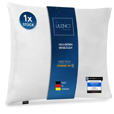 A white pillow with a blue band of text and logos.
