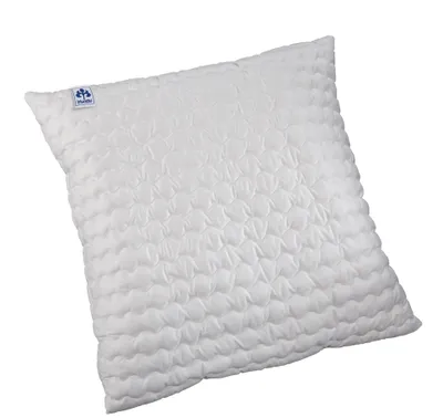 A white pillow with a textured surface is shown against a white background.