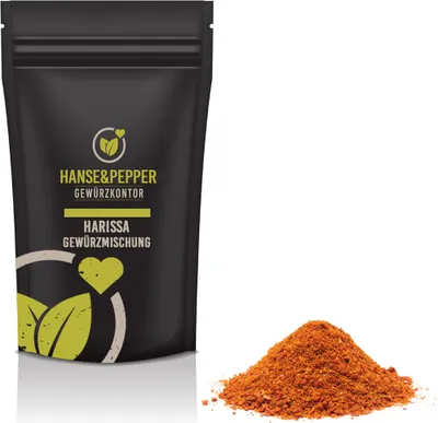 A black pouch of Harissa spice mix and a pile of the spice mix next to it, on a white background.