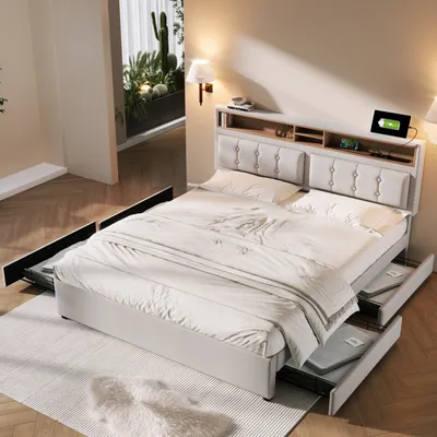 A bedroom scene featuring a bed with storage drawers and a headboard with integrated charging ports.