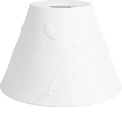 A white porcelain lampshade with embossed birds and branches.