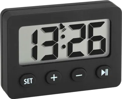 A black digital travel alarm clock with a gray display showing the time 13:26 and a bell icon.