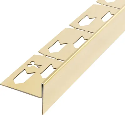 A close-up, angled view of a gold-colored metal corner profile with cutouts.