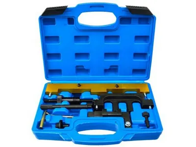 A set of car engine timing tools in a blue plastic case.