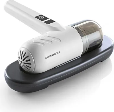A handheld vacuum cleaner is shown resting on its charging base.