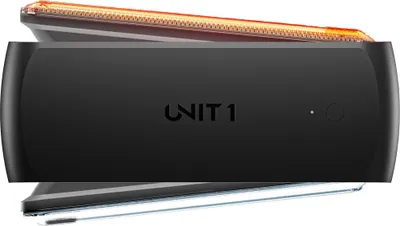 A product shot of a black electronic device with an orange light strip on top.