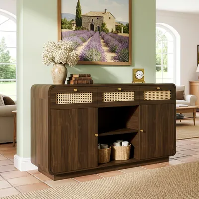 A wooden sideboard with rattan accents in a living room setting, with a painting of a lavender field above it.