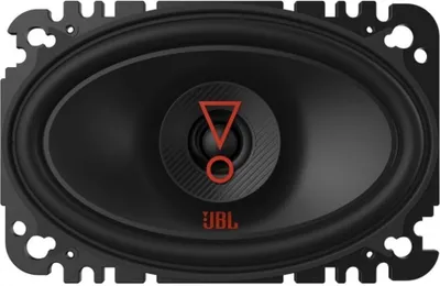 A close-up studio shot of a black oval car speaker with orange branding.