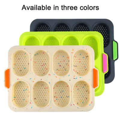Three baking pans in different colors, stacked on top of each other.