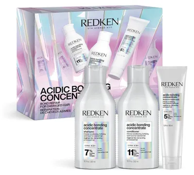 Immagine prodotto di Set festivo Redken Acidic Bonding Concentrate: Shampoo 300 ml + Balsamo 300 ml + Trattamento senza risciacquo 150 ml