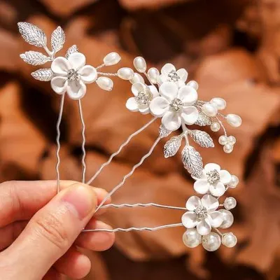 Immagine prodotto di Accessori per capelli in argento con perle, ideali per le spose